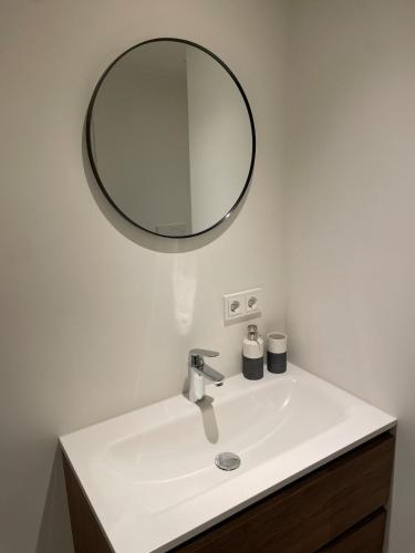 a bathroom sink with a mirror above it at 't Meuleveld in Harskamp
