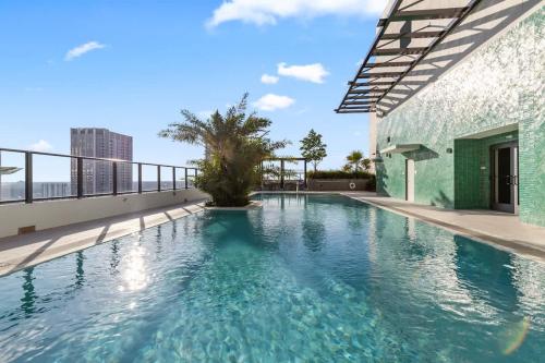 a swimming pool on the roof of a building at Downtown Luxury Condo withPool & Skyline Views in Miami
