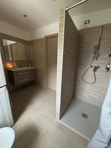 a bathroom with a shower and a sink at Apartment Jasmina in Venzone
