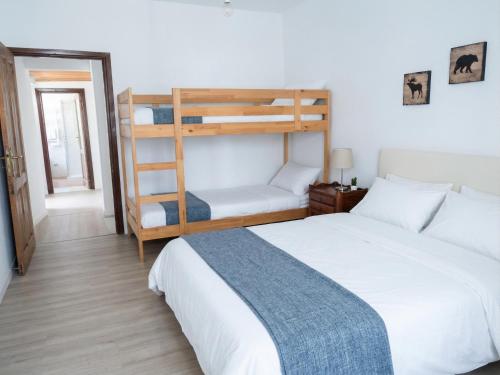 a bedroom with two beds and a bunk bed at La Chiave del Gufo - Bojano in Boiano