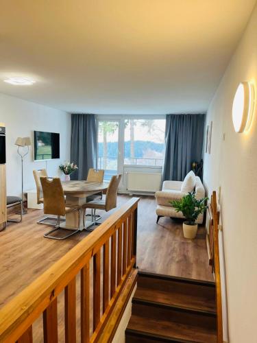 a large living room with a table and chairs at Ferienwohnung Nelli in Sankt Englmar
