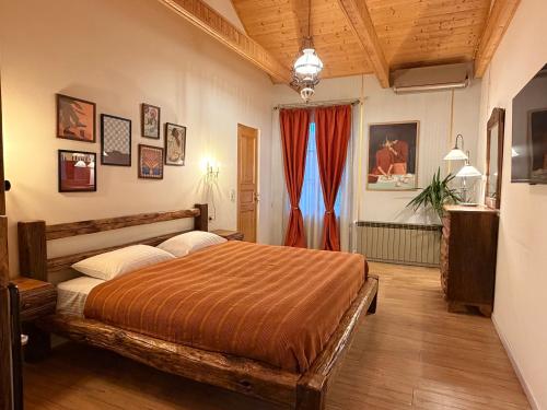 a bedroom with a bed in a room at Hotel Commune 1889 in Kutaisi