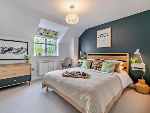 a bedroom with a large bed with a tray on it at 2 Bed in Helmsley oc-g0037 in Helmsley