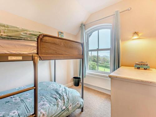a bedroom with two bunk beds and a window at 3 Bed in Freshwater oc-92961 in Freshwater