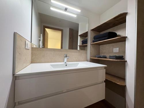 a bathroom with a sink and a mirror at Gîte d'Eléonore in Rupt-sur-Moselle