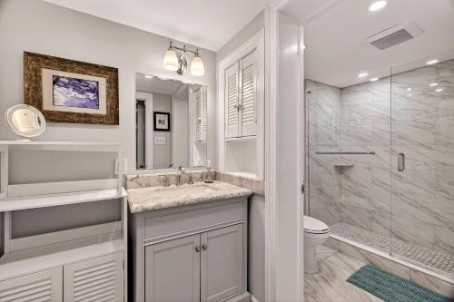 a bathroom with a shower and a sink and a toilet at Troup Square Manor Garden by Lucky Savannah in Savannah