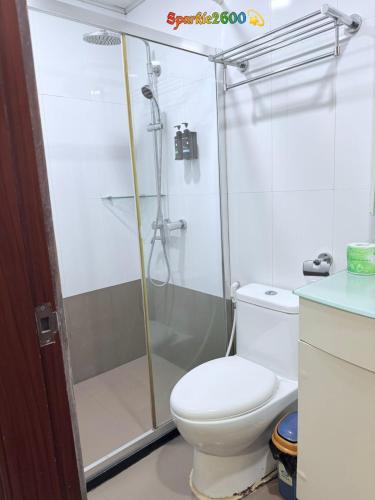a bathroom with a shower and a toilet at Sparkle2600 at Megatower 1 in Baguio