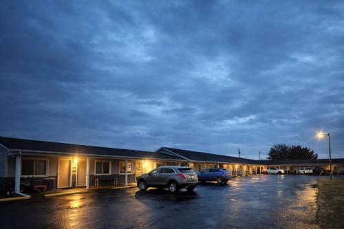 a parking lot in front of a motel at Budget Inn by Hotel O Greensville I 70 in Greenville