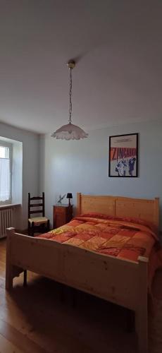 a bedroom with a large bed in a room at Guest Art House Aurora in Pissignano