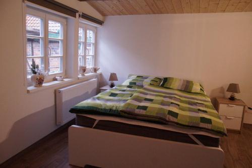 מיטה או מיטות בחדר ב-Fachwerkresidenz Deuterscher Hof