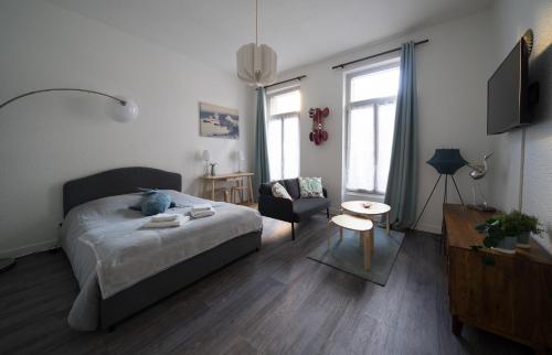 Llit o llits en una habitació de AppartUnique - Chez Murillo