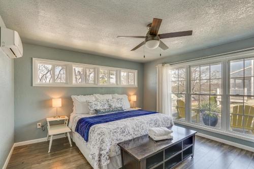 a bedroom with a bed and a ceiling fan at ‘Cliff View Haven’ | Million-Dollar Views at 6MM in Rocky Mount