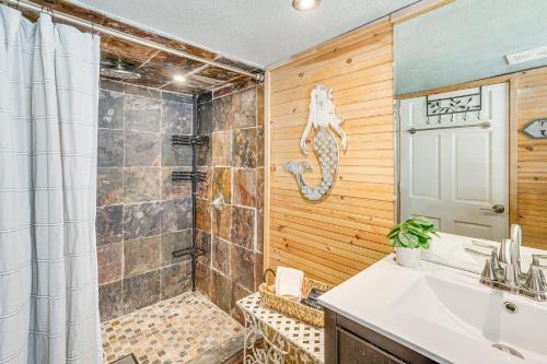 a bathroom with a shower and a sink and a toilet at ‘Cliff View Haven’ | Million-Dollar Views at 6MM in Rocky Mount