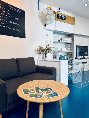 a living room with a couch and a coffee table at Hostel Albergue Baionamar in Baiona