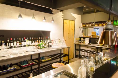a bar with a lot of bottles of wine at Meeting Mates Hostel in Taipei