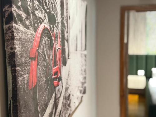 a painting of a train on a wall at Agora ApartHotel in Tirana