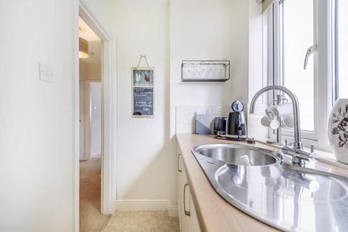 a bathroom with a sink and a window at Quarry Heights in Bowness-on-Windermere