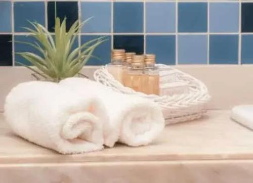 a towel animal sitting on top of a bathroom sink at Grande Hotel Termas de Araxá in Araxá