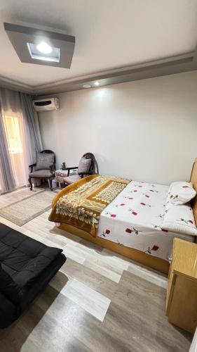 a bedroom with a large bed in a room at Spring house in Qaryat Shākūsh
