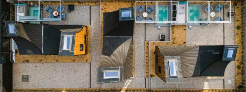 an overhead view of a building with windows at Three Peaks Thermal Villas in Banya
