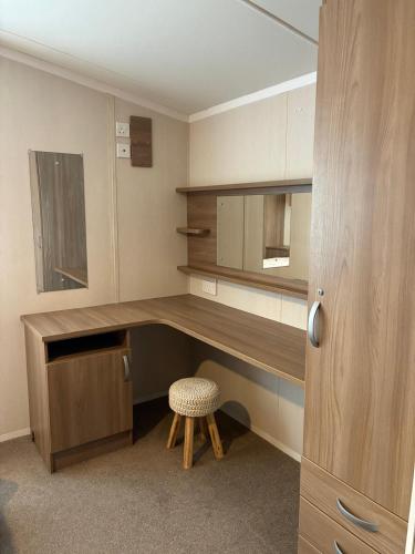 a room with a desk with a chair and a mirror at Bordeaux sea view no 9 in Ardentinny