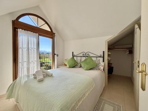 a bedroom with two beds and a window at Casa individual - Villa Castillo 7804 in Castillo