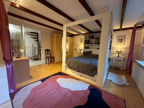 a bedroom with a large bed in a room at Ferienwohnung Löffel-Lodge in Heimbach