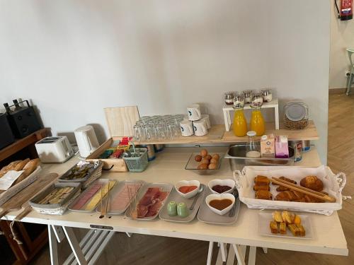 a table with many different types of food on it at Hotel Boutique La Brisa del Mar in Estepona