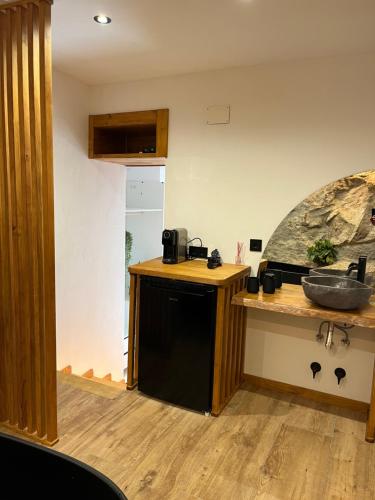 a kitchen with a sink and a counter top at La Posada de Botavara in Mijares