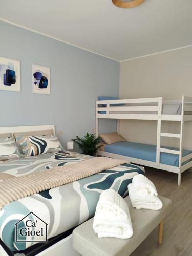 a bedroom with a bunk bed and a ladder at Ca' Gioel in Sedrina