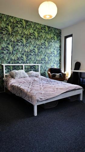 a bedroom with a large bed in a room at Dom Mazury in Langendorf