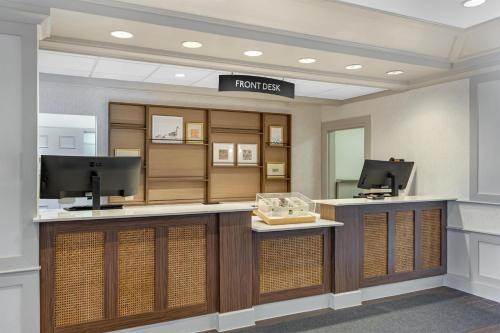 a lobby of a hotel with a reception desk at Sonesta ES Suites Orlando - Lake Buena Vista in Orlando
