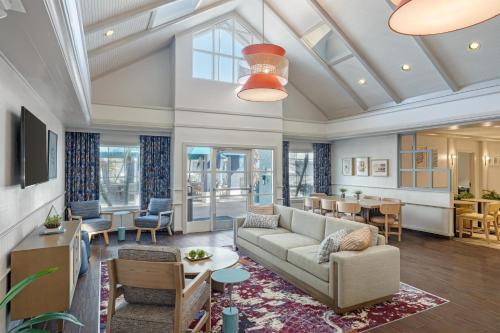 a living room with a couch and a table at Sonesta ES Suites Orlando - Lake Buena Vista in Orlando