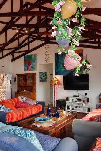 a living room with two couches and a table at The Wilderness Way in Wilderness