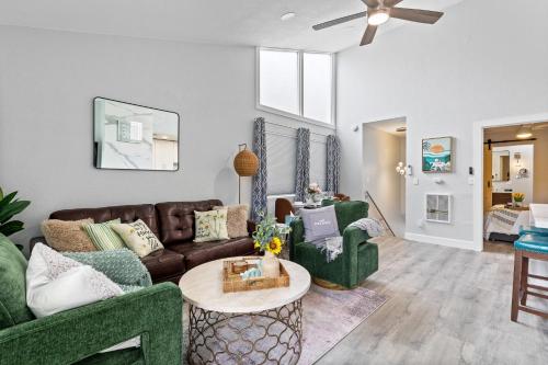a living room with a couch and a table at Endless Sunset- Near Beach Surf and Pet Friendly in Huntington Beach