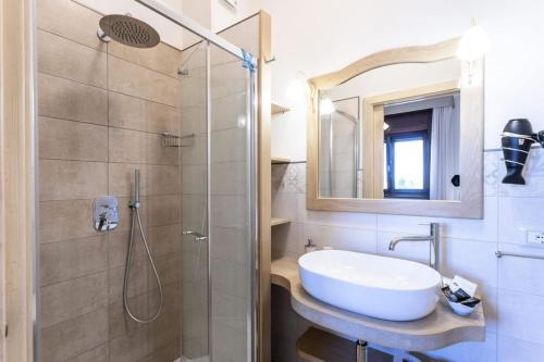 a bathroom with a sink and a shower at Domus Japigia in Ugento