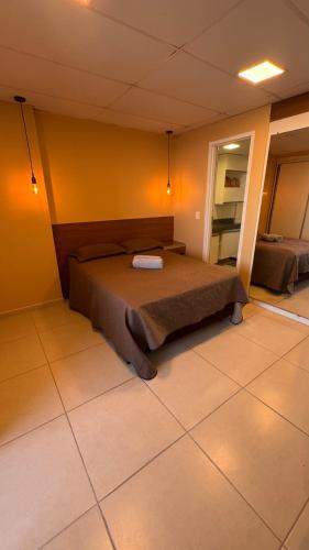 a bedroom with a bed in a room at Jam flats beira mar Olinda in Olinda