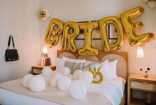 a bed with a happy new year sign on it at Expansive 7 Bedroom Home Heated Pool & Spa in New Orleans