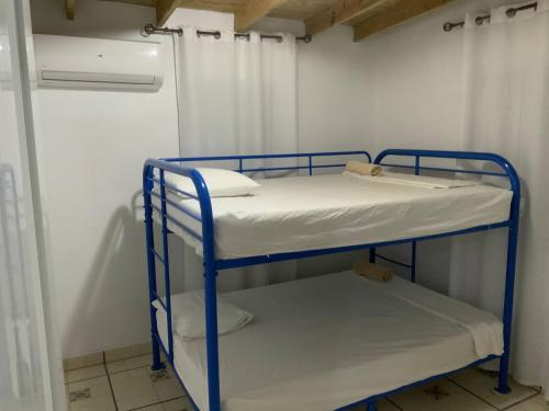 a bunk room with two bunk beds in it at Cozy 2BR Cabin with Pool in Cabo Rojo in Cabo Rojo