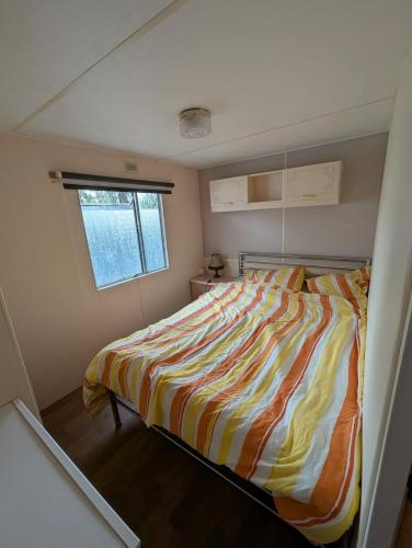 a bedroom with a bed in a small room at Casa di Palli in Mariënberg