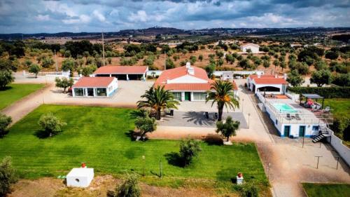 an aerial view of a house with a yard at Monte da Pechincha - Casa de Hóspedes & Spa in Estremoz