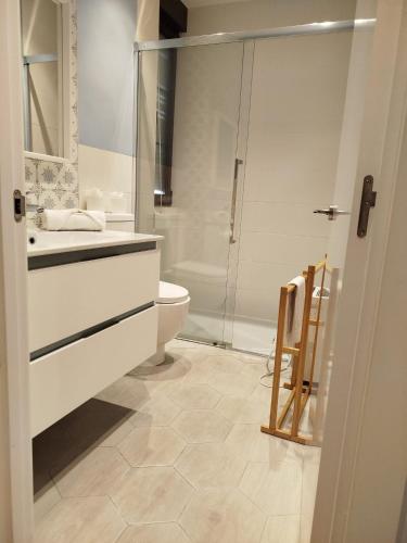 a bathroom with a shower and a sink and a toilet at R2R - Apartamento cerca del mar - 14A12 in Lastres