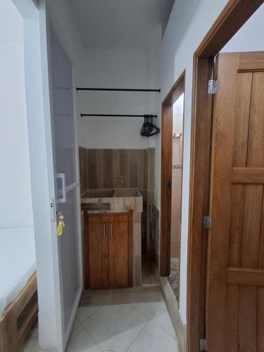 a bathroom with a sink and a shower at Cabañas Mar Caribe in Necoclí
