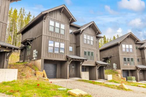 a large wooden house with a garage at Bridger Bowl - Crosscut Hideaway in Bozeman