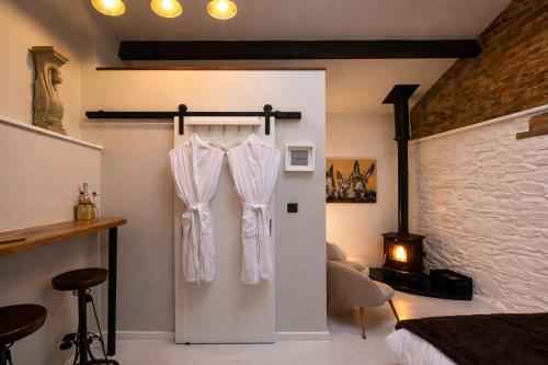a bedroom with a white curtain hanging on a wall at Copper Cove at Lough Sillan House - Adults only in Shercock