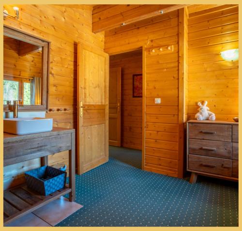 a bathroom with a sink and a vanity with a sink at Olaf Chalet IT5 I Les Gets in Les Gets