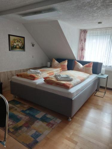 a bedroom with a large bed in a room at Pension Reichel in Freiberg