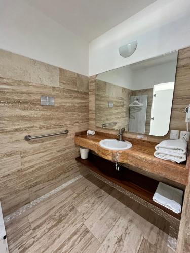 a bathroom with a sink and a mirror at Vita Grand San Miguel de Allende in San Miguel de Allende
