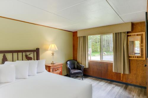 a hotel room with a bed and a window at Sol Duc Hot Springs Resort in Ovington