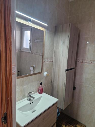 a bathroom with a sink and a mirror at Casa Dulcinea in Alborea